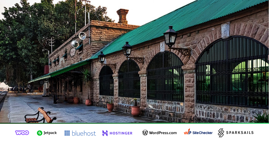 Historic stone station building with arched windows at Golra Sharif